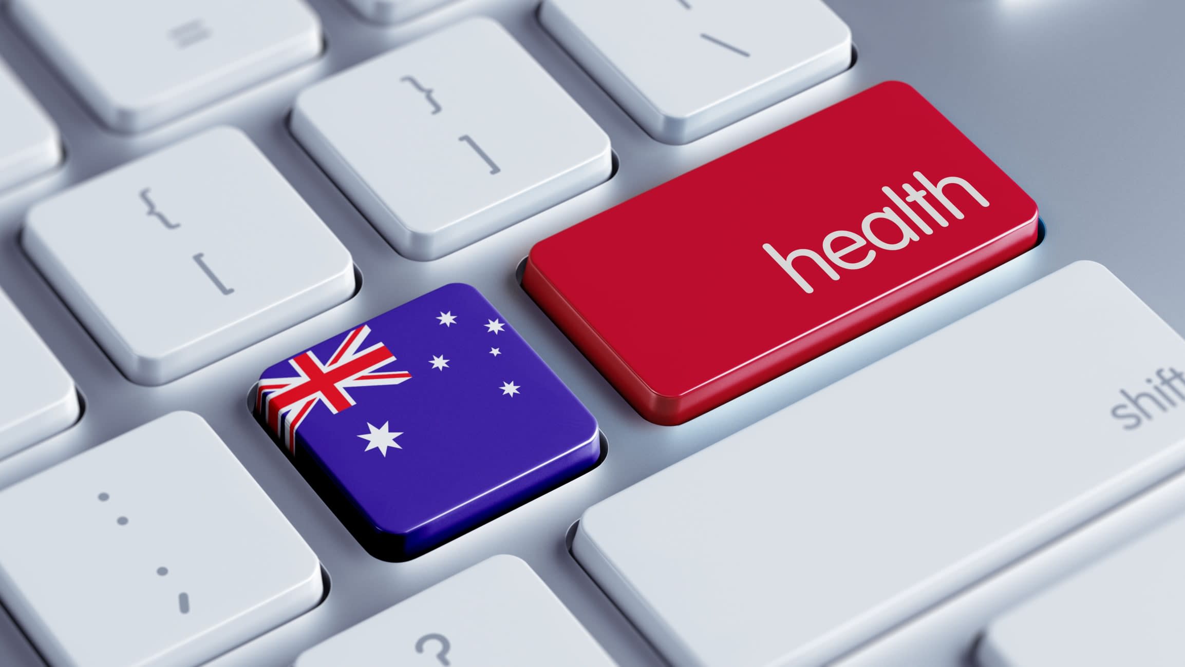 A white keyboard with a single red key reading 'health', and a smaller key depicting the Australian flag