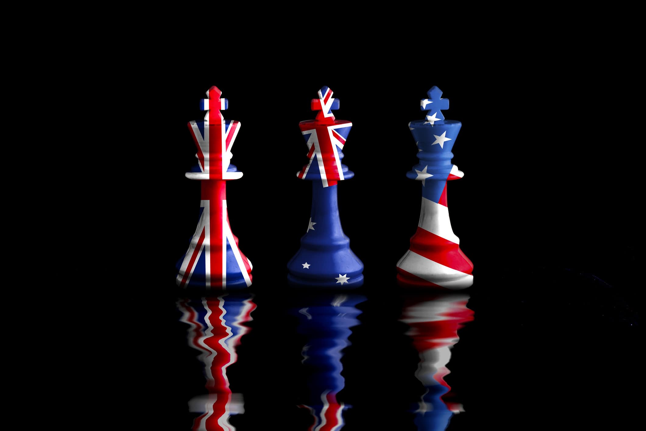 US, Australia and Great Britain flags painted on chess king pieces