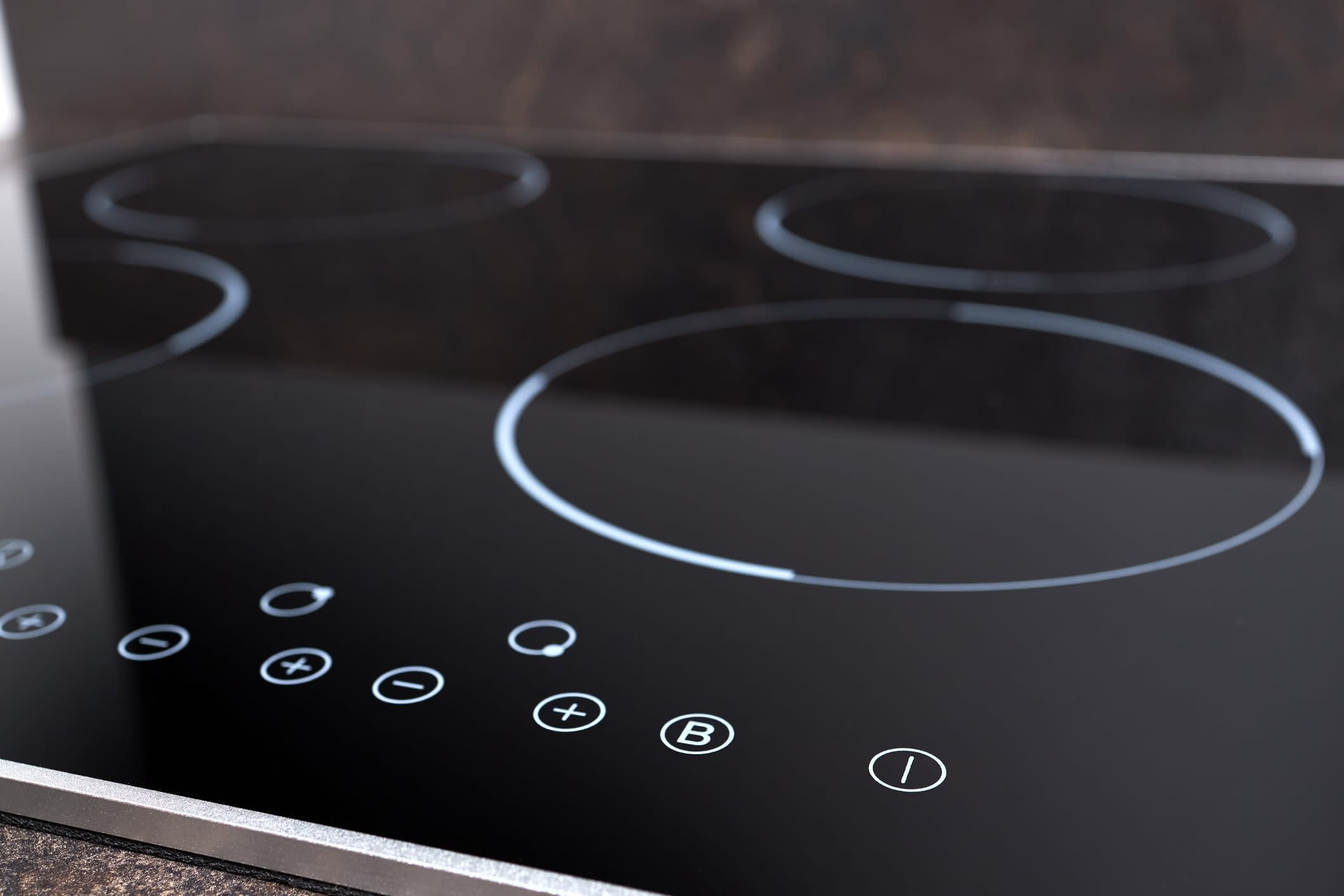 an induction cooktop with control panel buttons