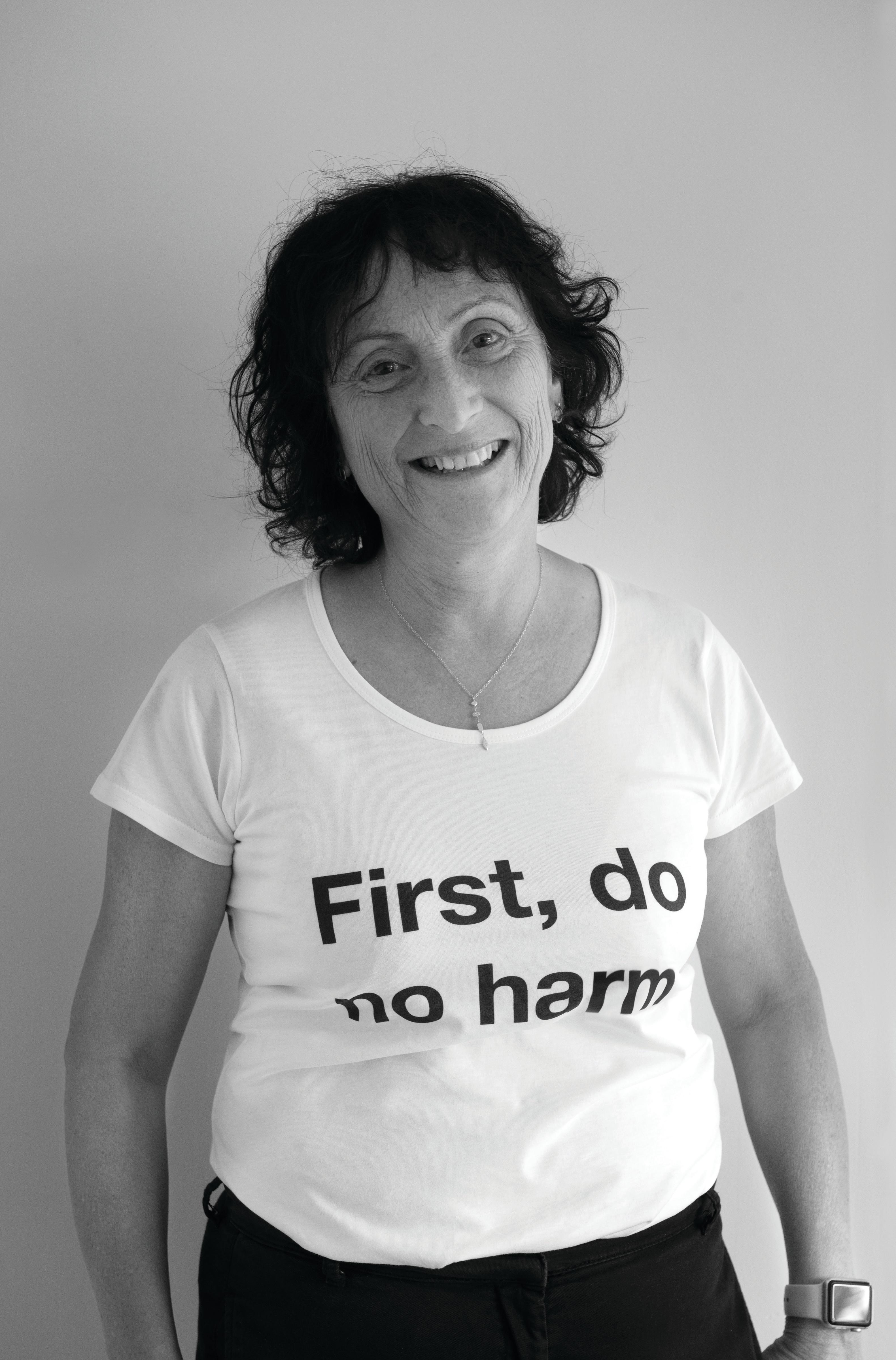 Professor Rachelle Buchbinder wearing a t-shirt with the words "First, do no harm".