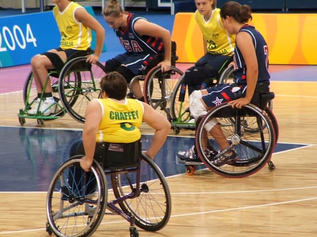 Action shot of Australia versus USA in an Olympic Games wheelchair basketball match in Athens in 2004