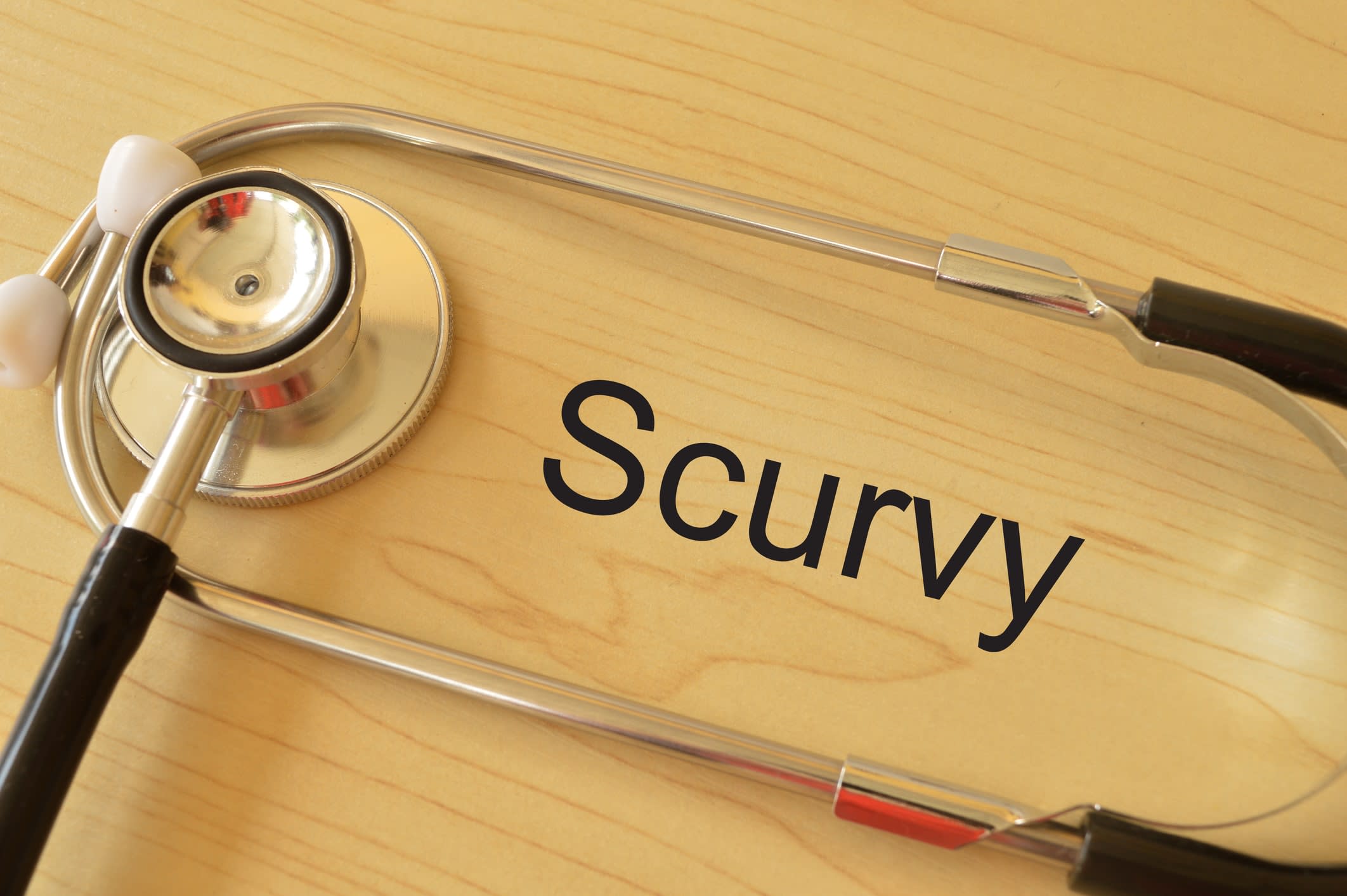 Stethoscope on the table with text SCURVY