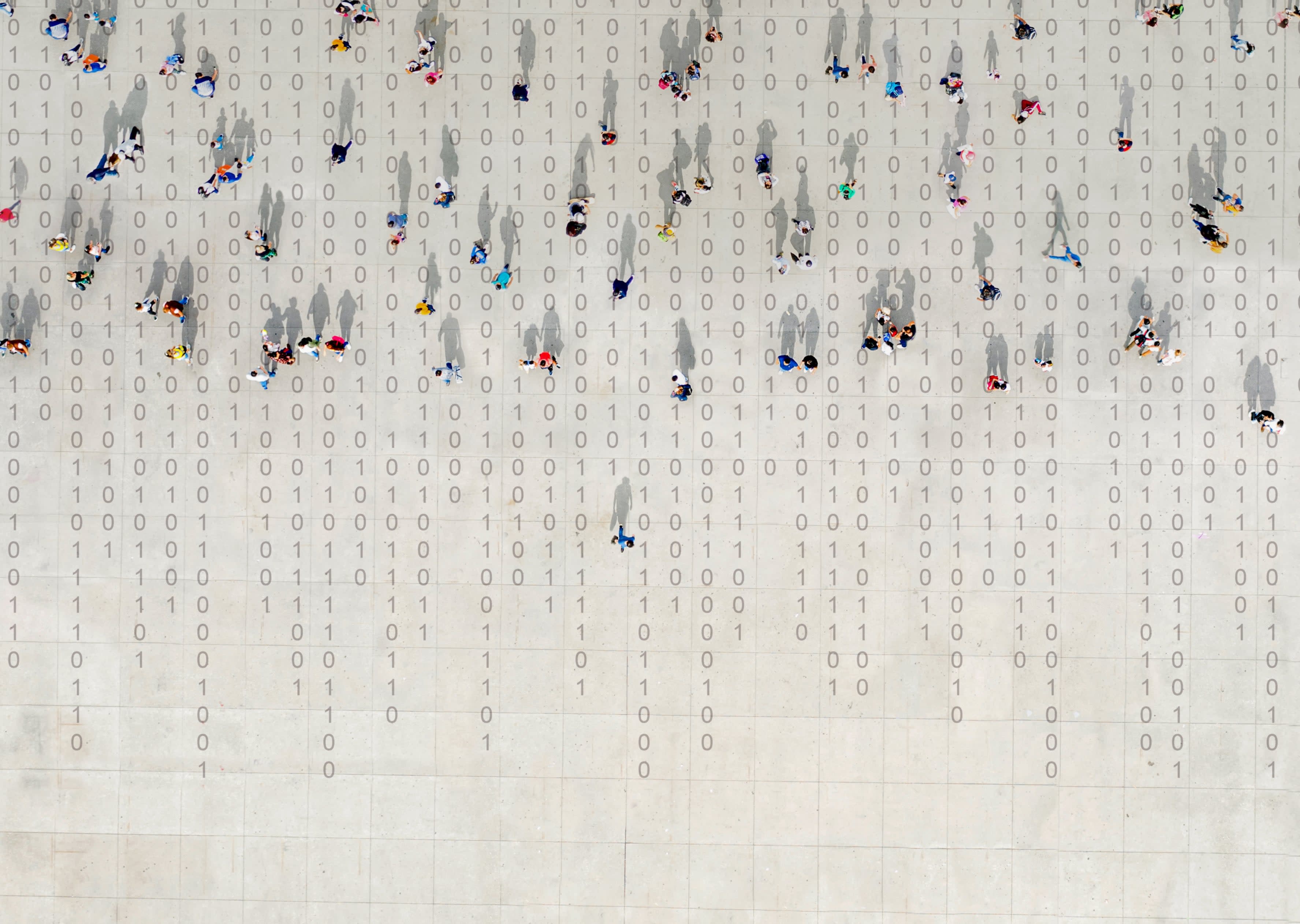 Stylised image of a crowd from above walking over binary code