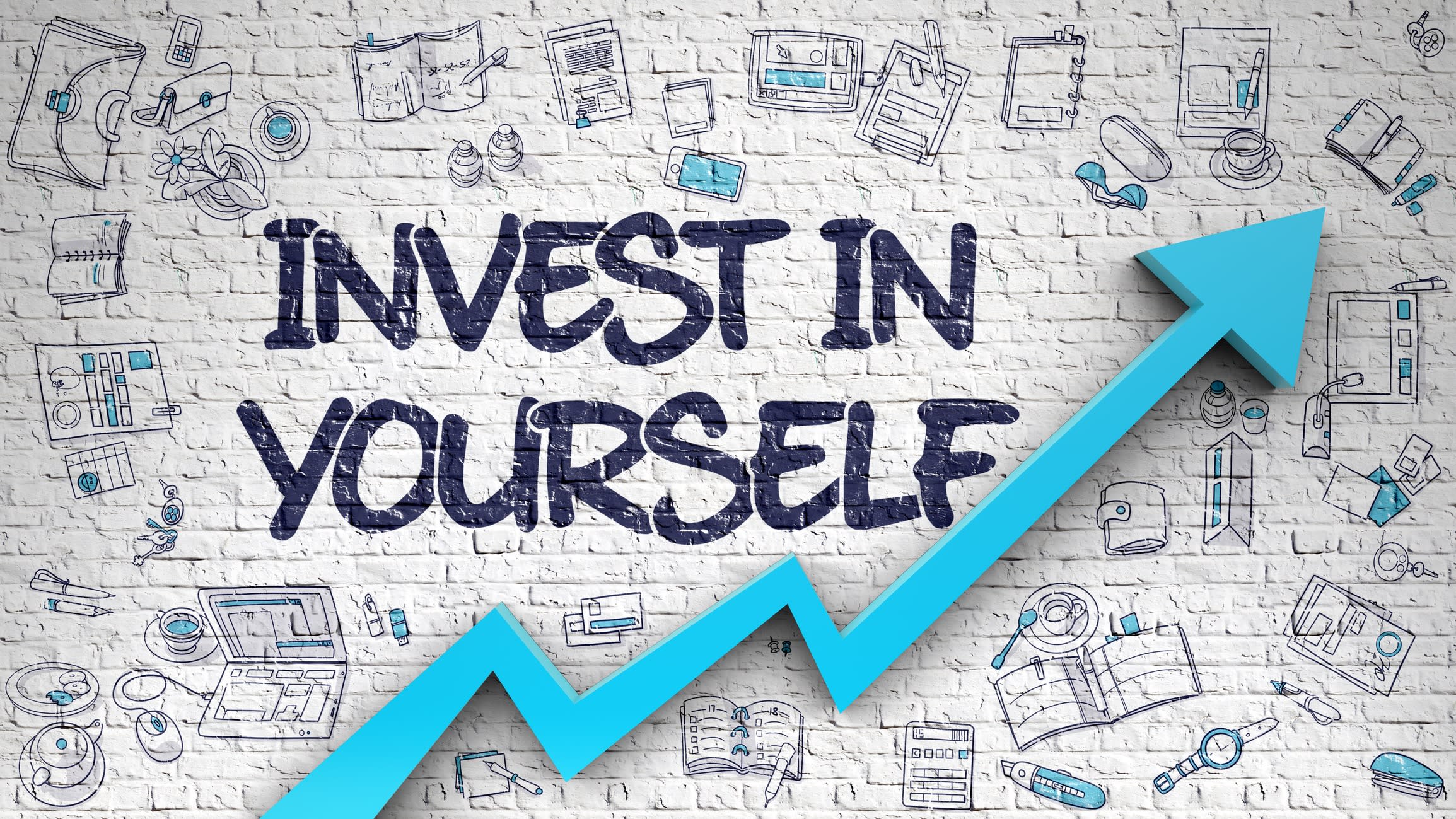 Invest In Yourself Drawn on White Brick Wall. with an arrow pointing upwards.