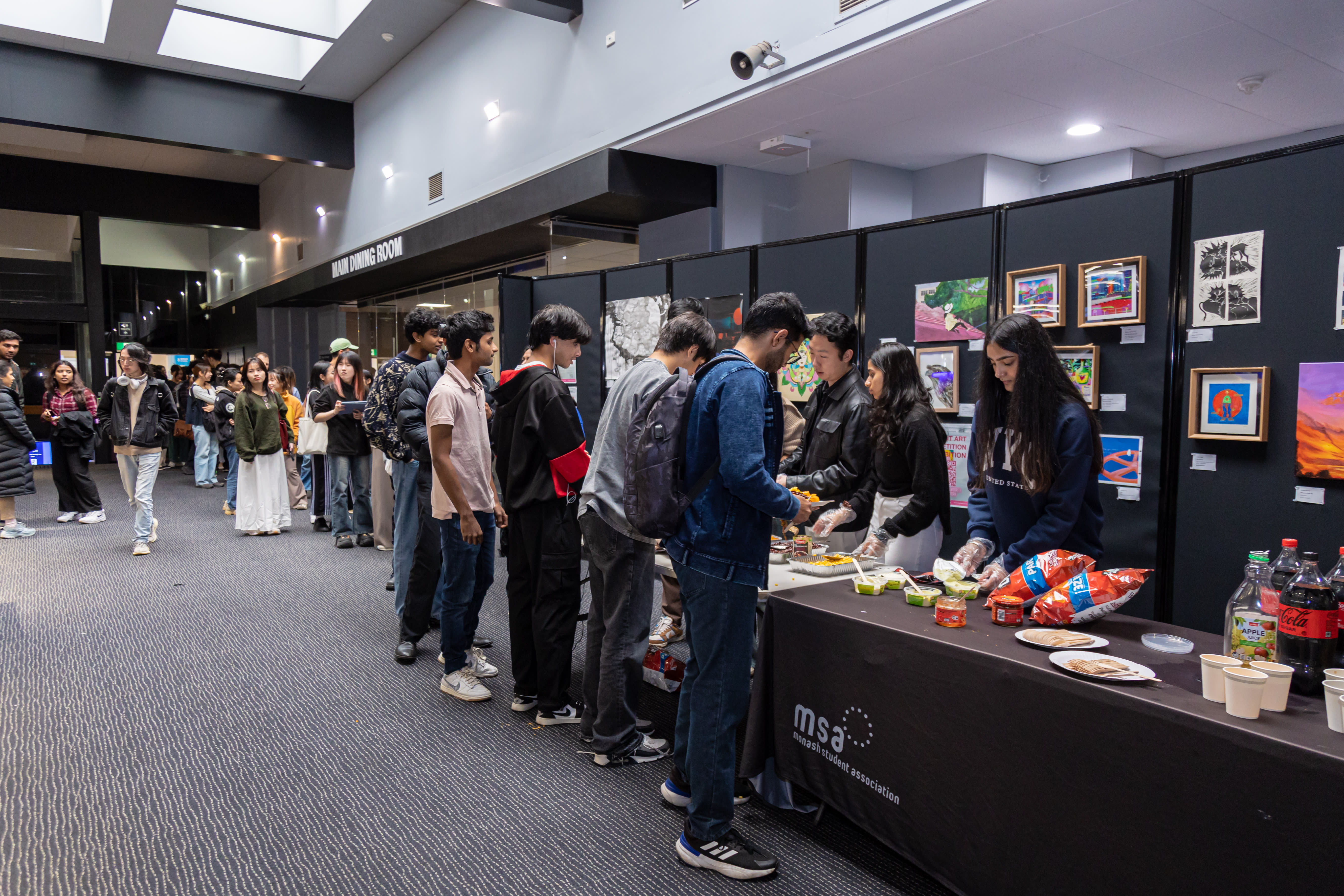 Caption: Over 150 students lined up for the latest welfare lunch at Monash’s Clayton campus.