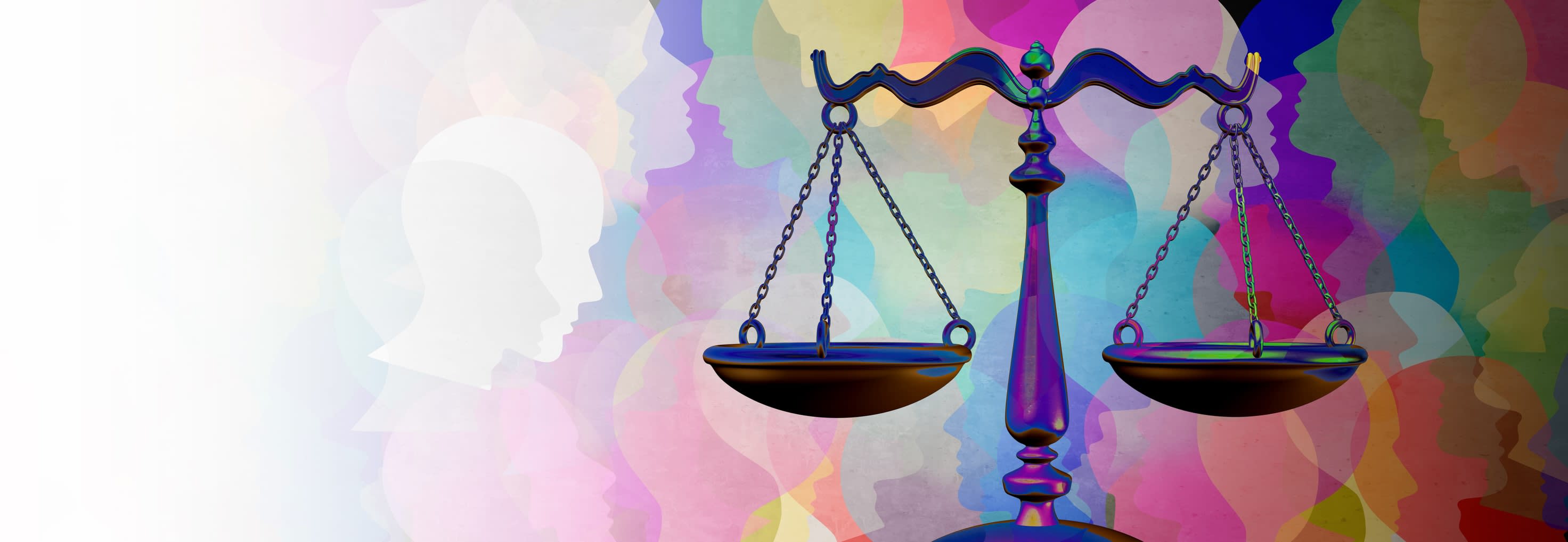 Justice scales with coloured silhouettes of people's heads in the background