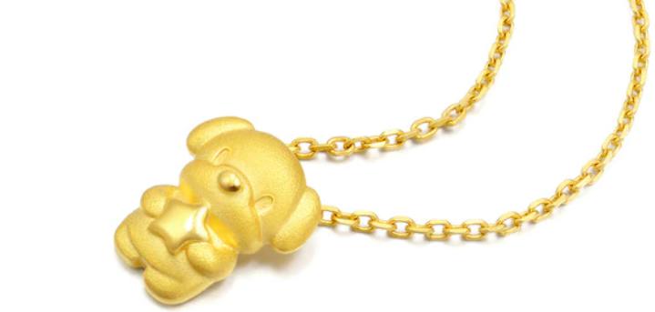 A gold dog pendant