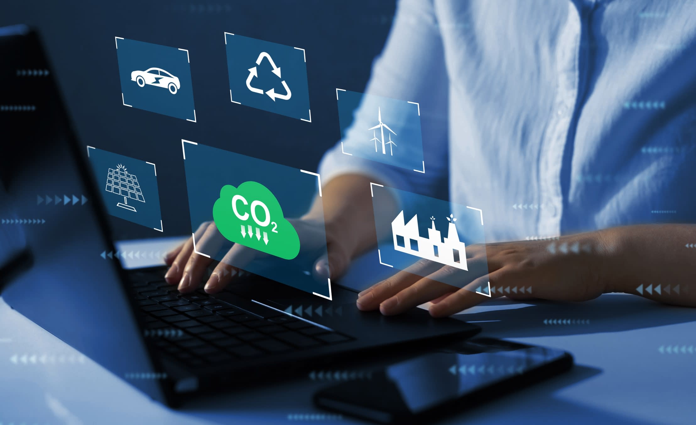 Man on a laptop with floating climate-related icons