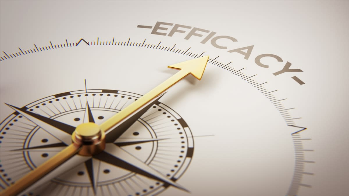 A compass with the needle pointing to the word 'efficacy'