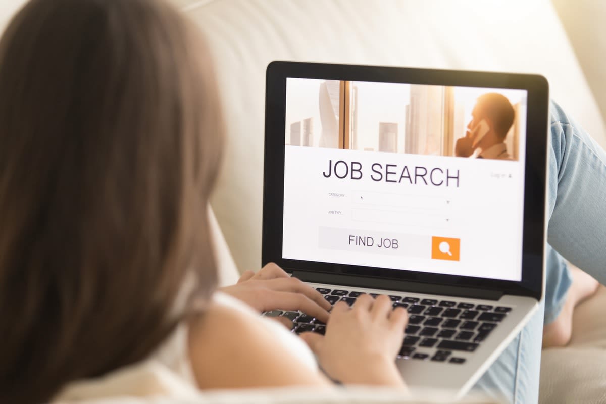 Woman on a laptop searching for a job 
