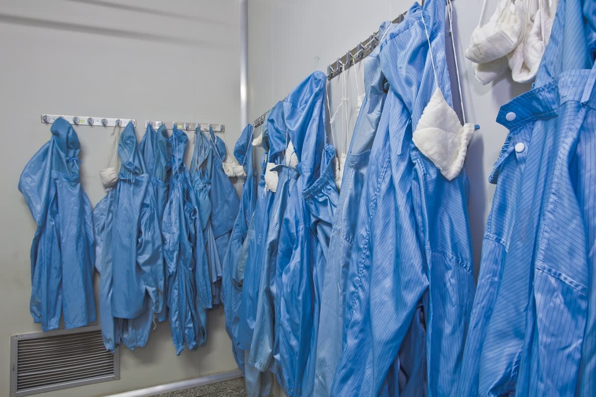 PPE equipment hanging on hooks in a room 