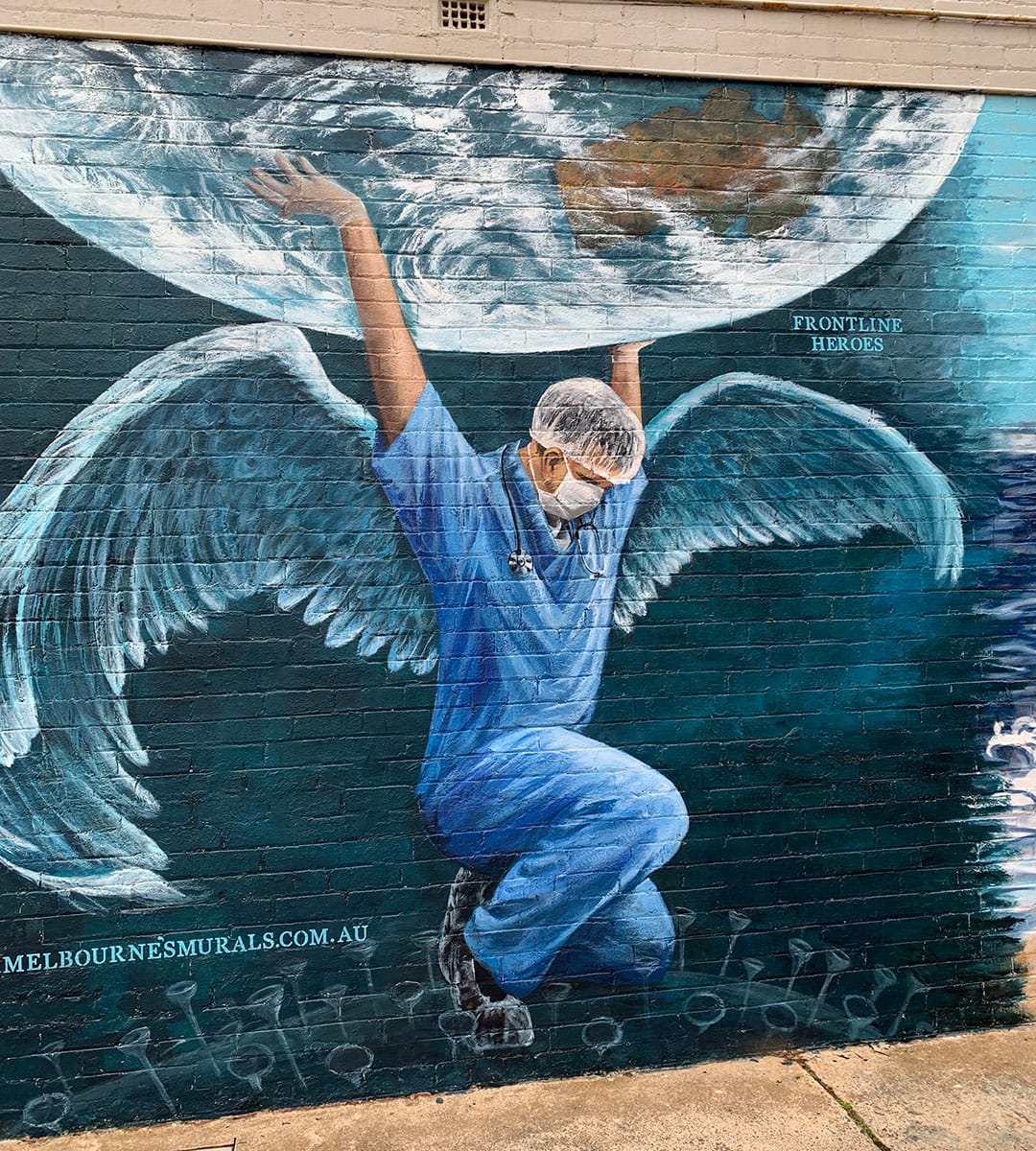 street art of nurse holding up world, Melbournes murals - Black Rock