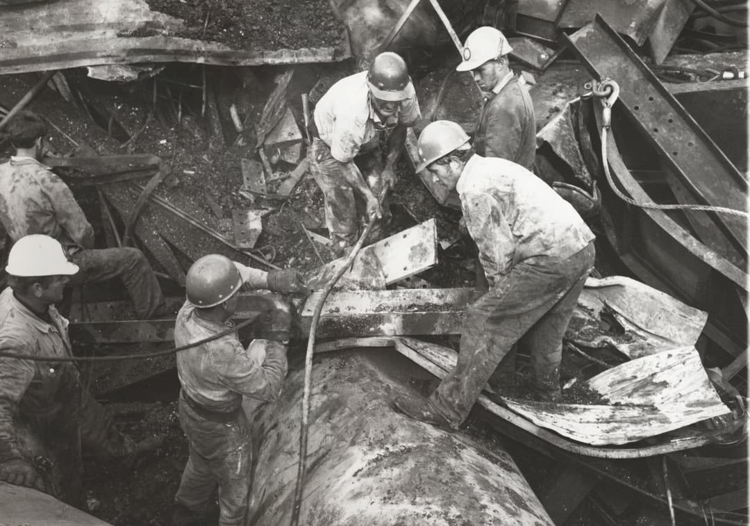 Rescuers search the West Gate Bridge rubble.