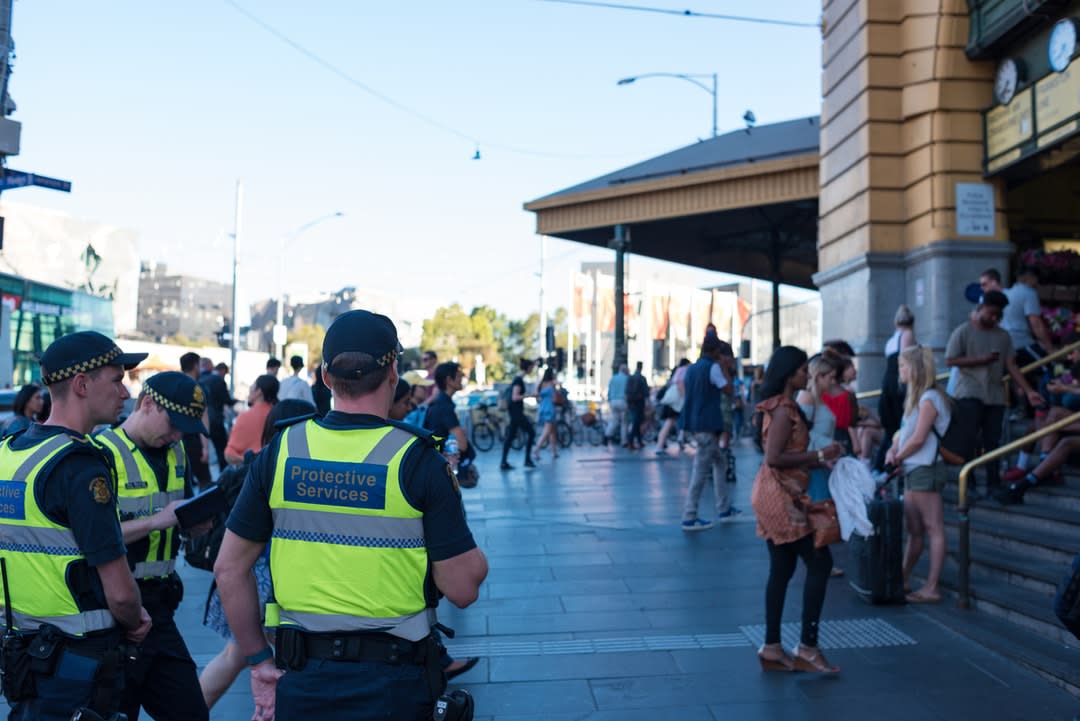 Protective Service Officers patrol Flinders Street, Melbourne.