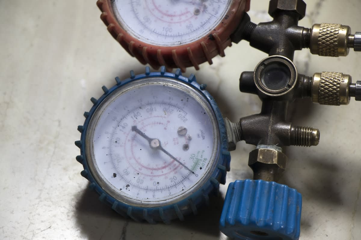 Close-up of an oxygen tank's pressure gauges