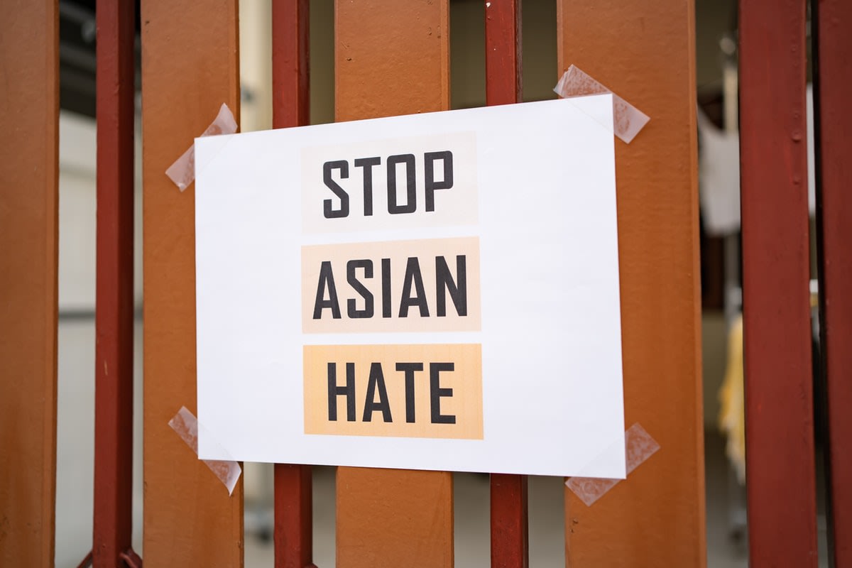 A sign taped to a fence reading ‘Stop Asian Hate‘ 