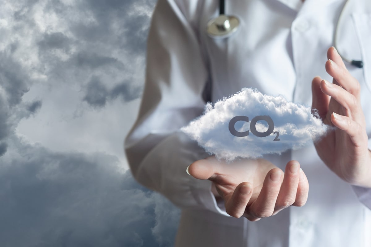 Doctor holding cloud with CO2.