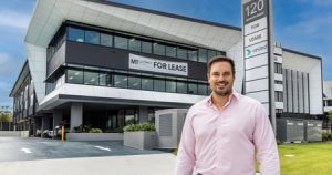 Adrian Puljich outside GemLife’s new national headquarters in Helensvale, Gold Coast. Photo: GemLife 