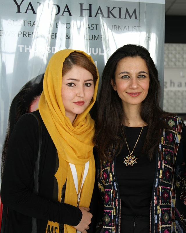Yalda Hakim standing with a Foundation member