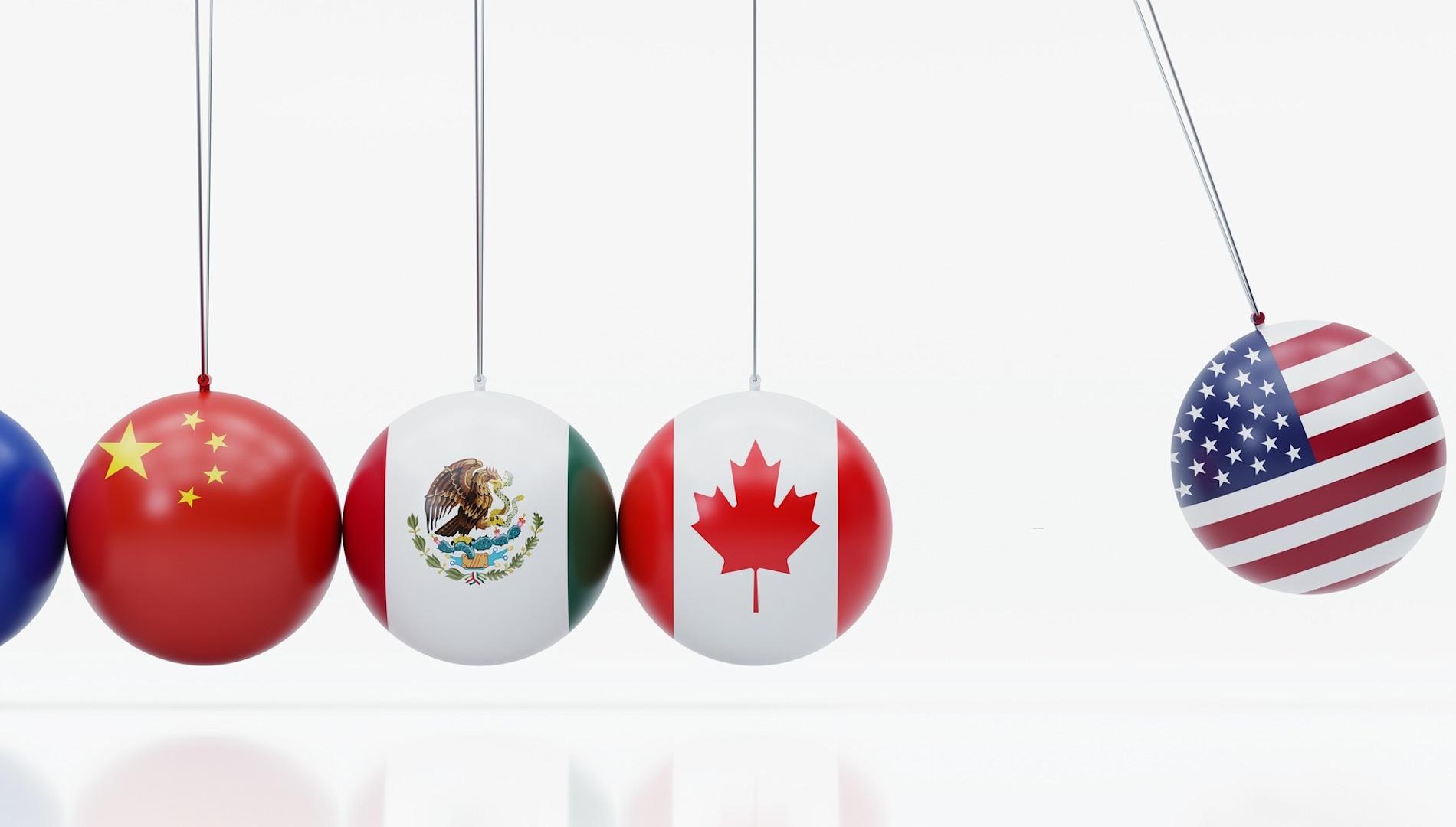 Newton's Cradle textured with American Canadian Mexican Chinese And European Union flags 