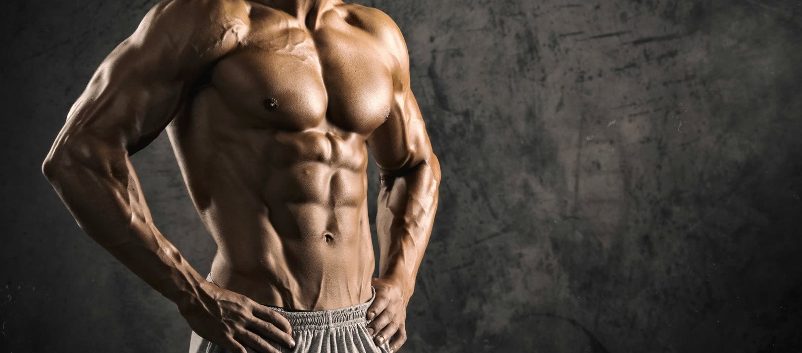 Portrait of a physically fit, muscular young man without a shirt.
