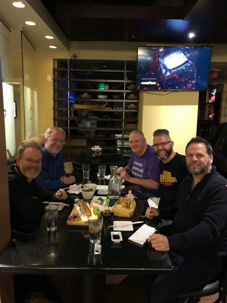 From Left to right, Jason Pamental, Eric Meyer, Todd Libby, Jason Ogle, and Derek Featherstone sitting at a table at dinner in Denver, Colorado. Photo courtesy of Jason Ogle