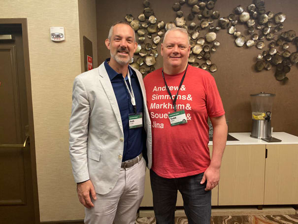 Josh Clark and Todd Libby at An Event Apart Denver in the hallway posing for a photo.