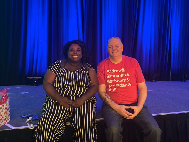 Mina Markham and Todd Libby sitting on stage at An Event Apart Denver posing for the photo.