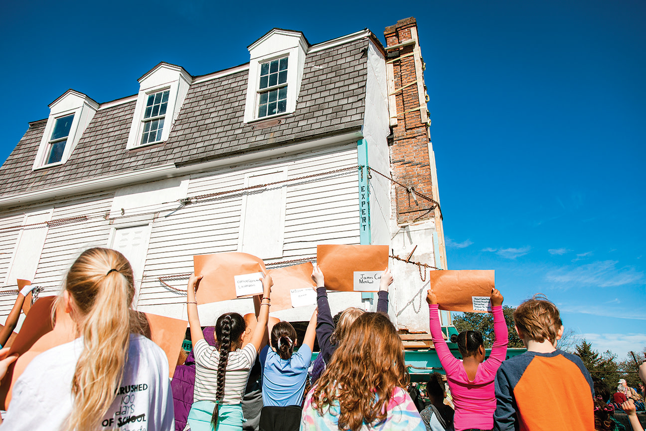 School children watch the moving of the Williamsburg Bray School