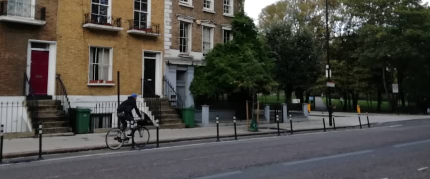 person cycling in pop up cycle lane 