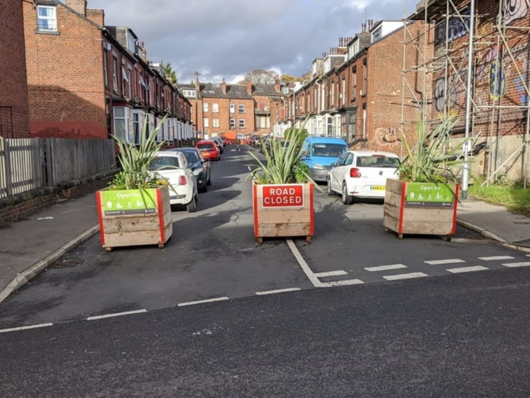 Planters stopping up a road.