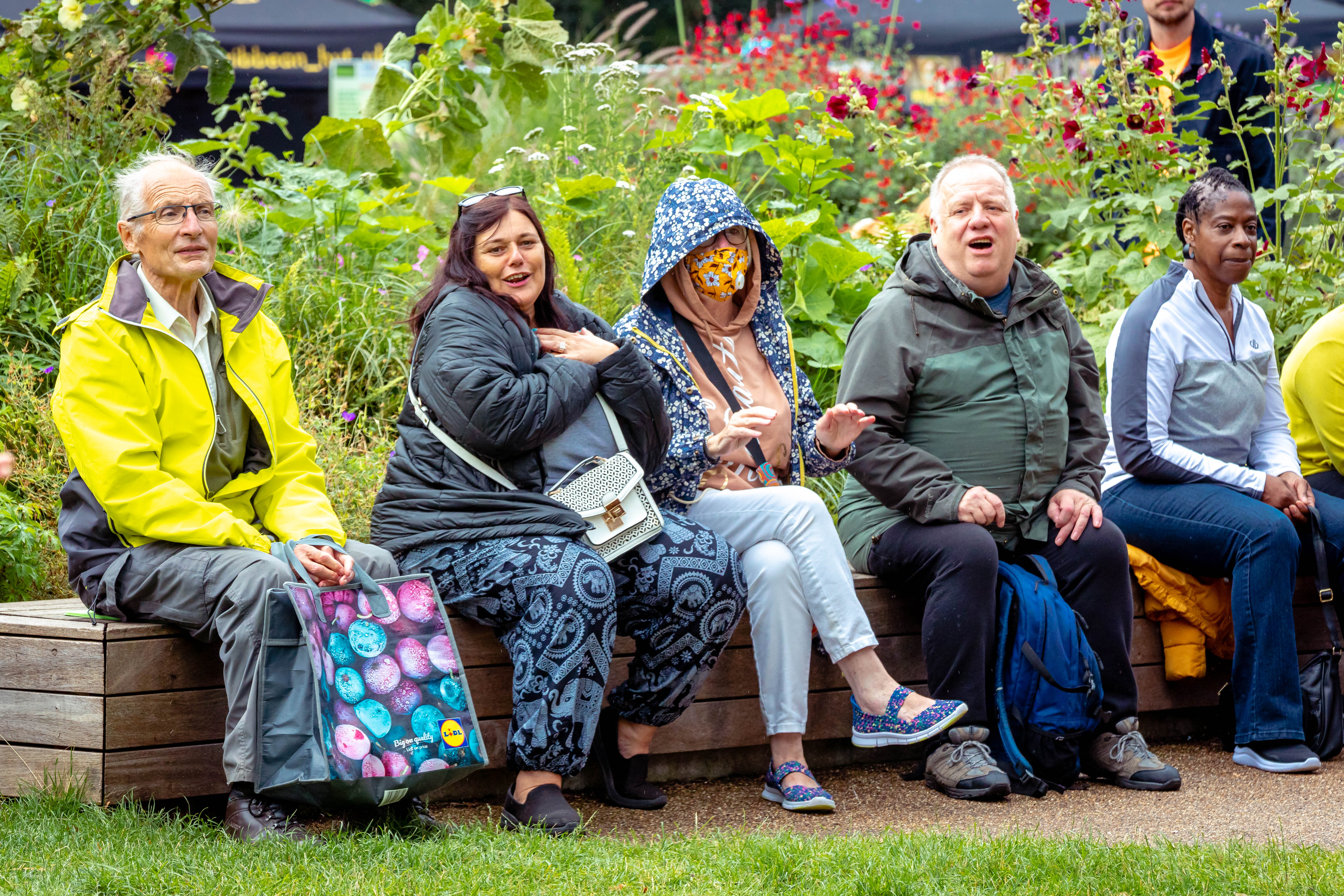 new-1People sitting nexxt to each other smiling