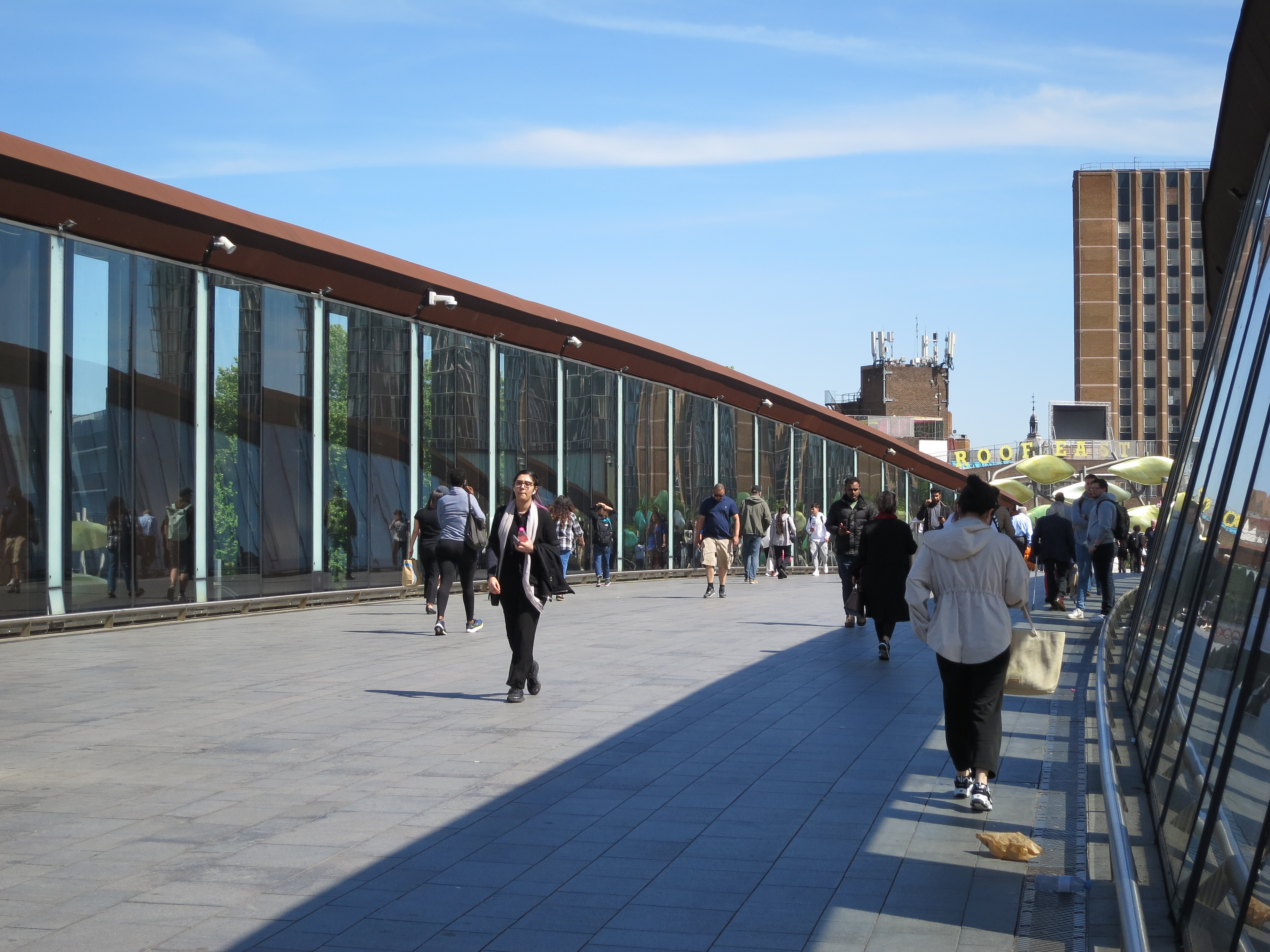 people walking on a walkway