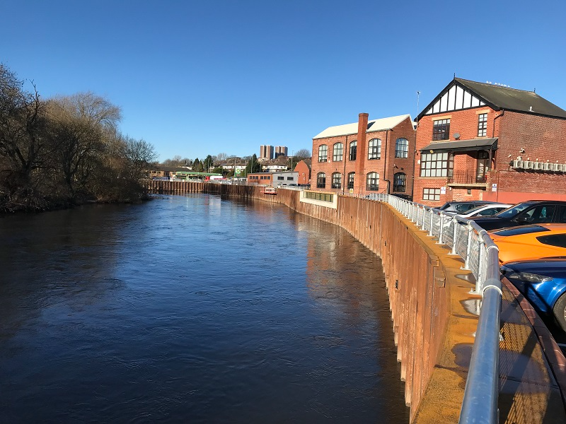 a body of water with buildings along it