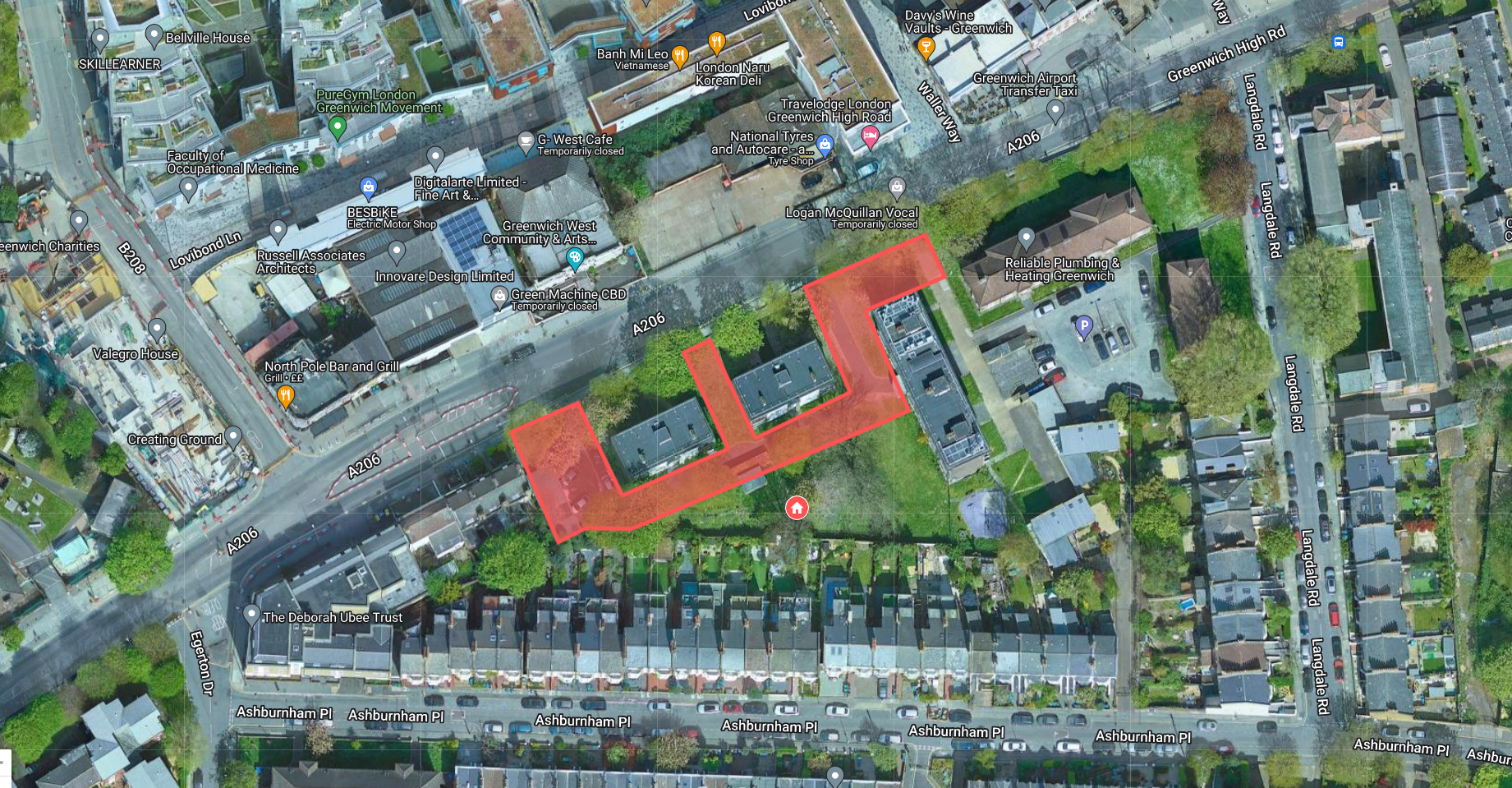 An aerial photo map with the area for the proposed new homes outlined in red. The site covers the car park to the west of and between the two existing residential blocks on Greenwich High Road, north of Ashburnham Place.