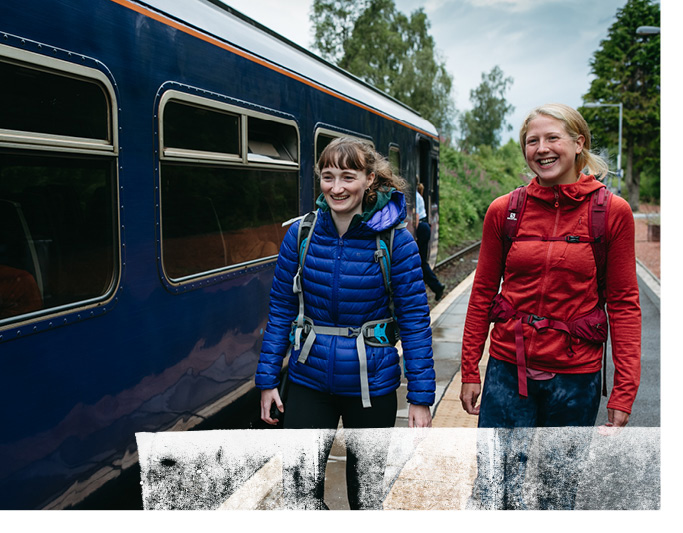 Two women on train station platform