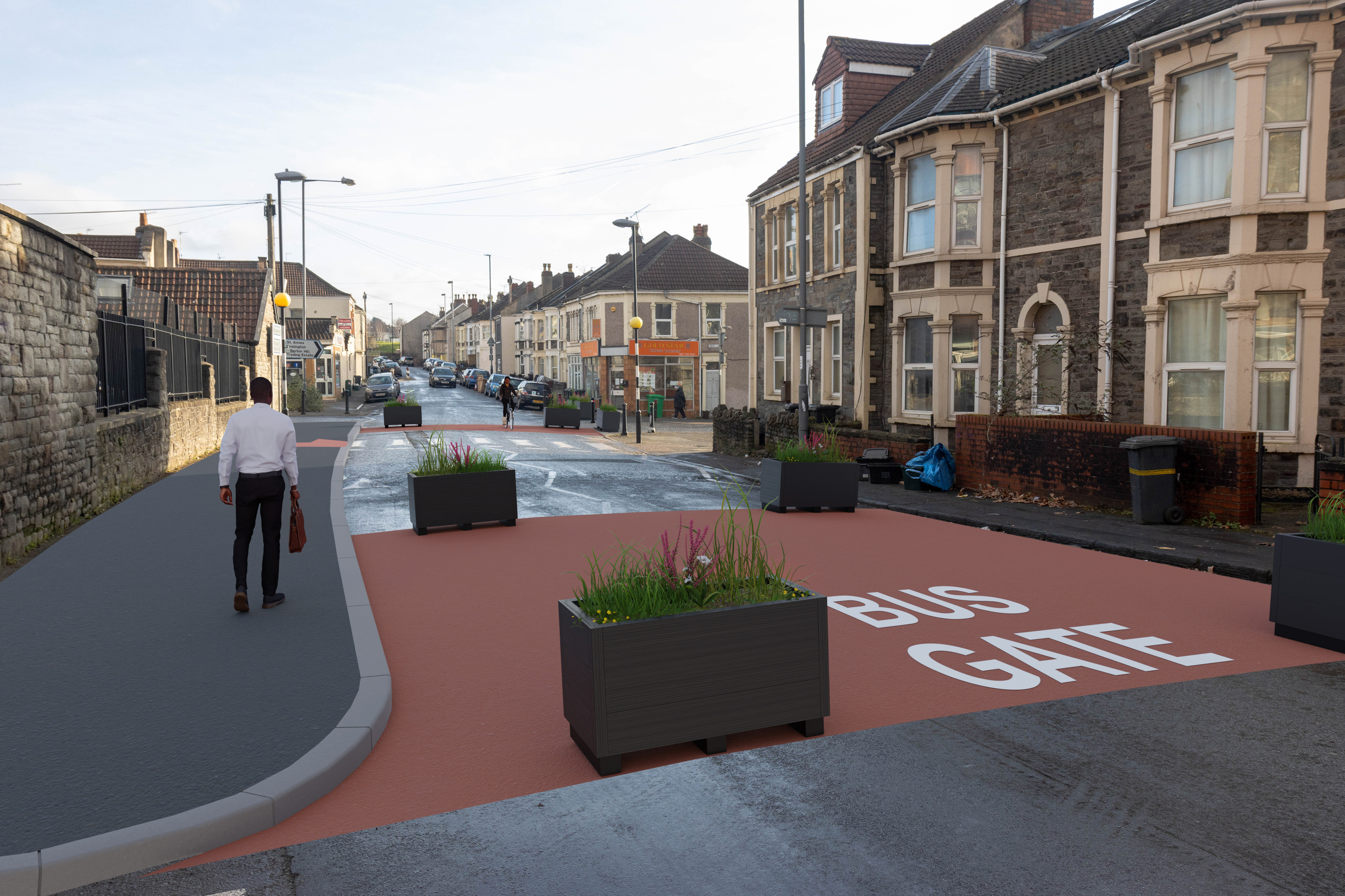 Planters used to narrow the road. Red surfacing to highlight that only buses can pass through this point. 