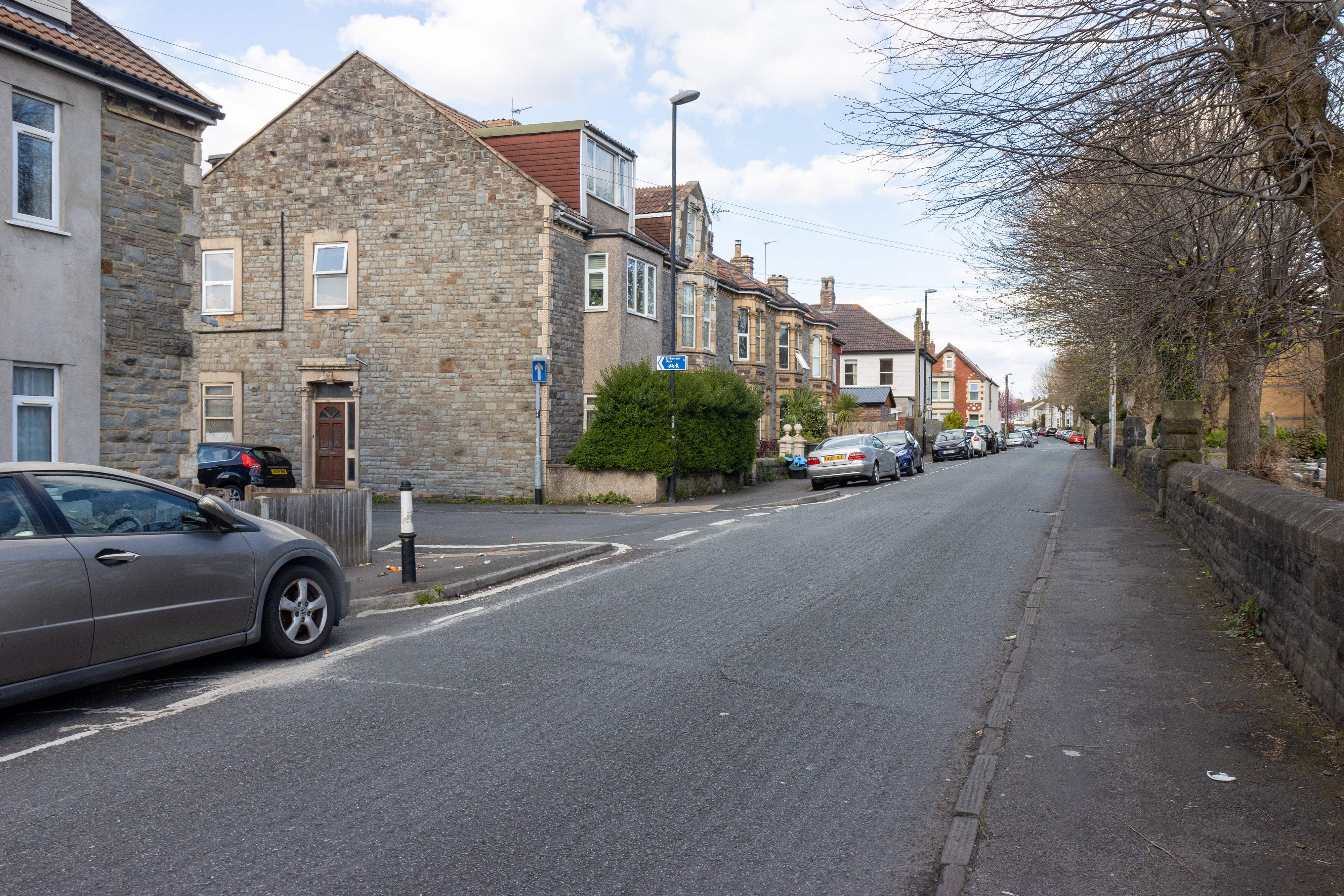 Car parked adjacent to the pavement.