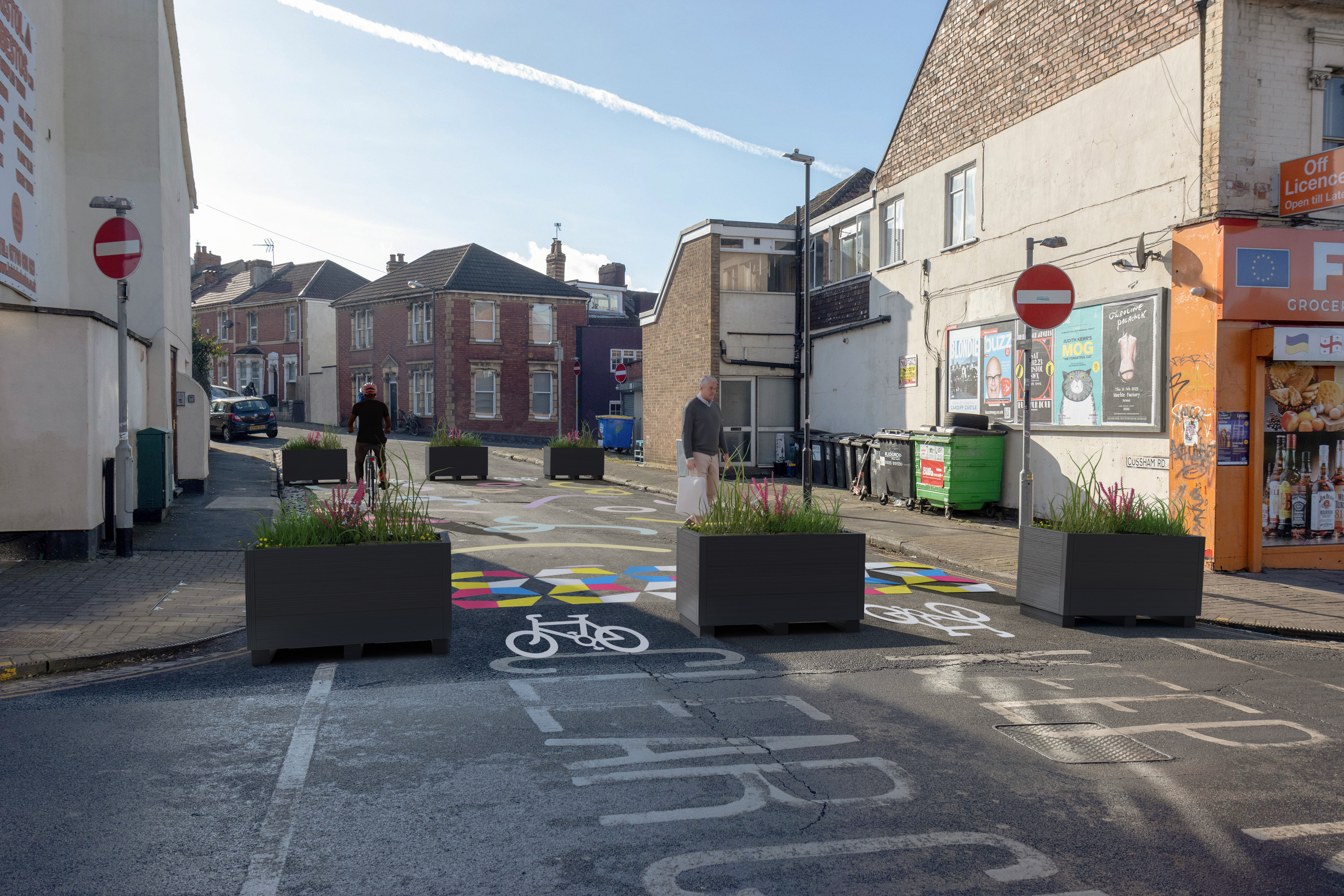 Planters used to stop vehicles from vehicles from entering the pedestrian space. Cycle symbols to show where cycles will pass. Loading bay to help businesses load and unload. 