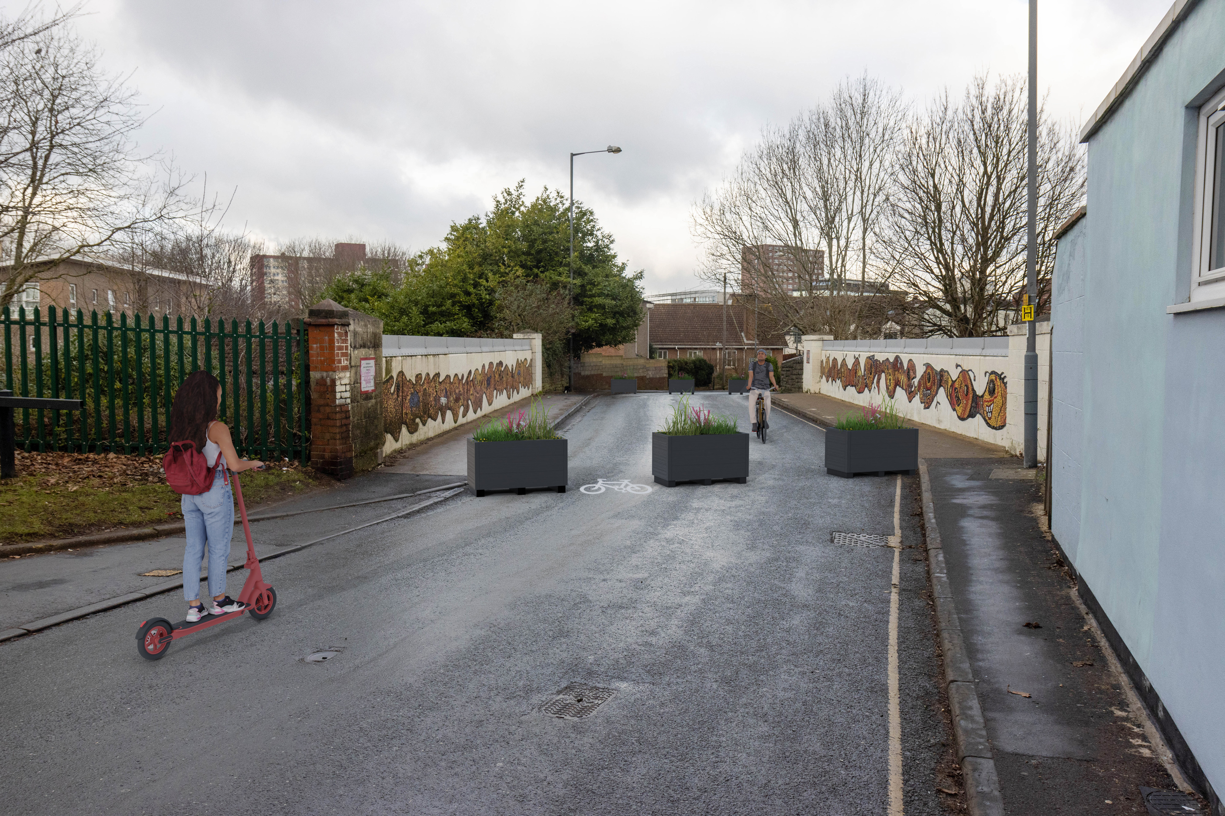 Planters and bollards at both ends of the railway bridge to stop vehicles entering the pedestrian area. Cycle symbols to show where cycles access.