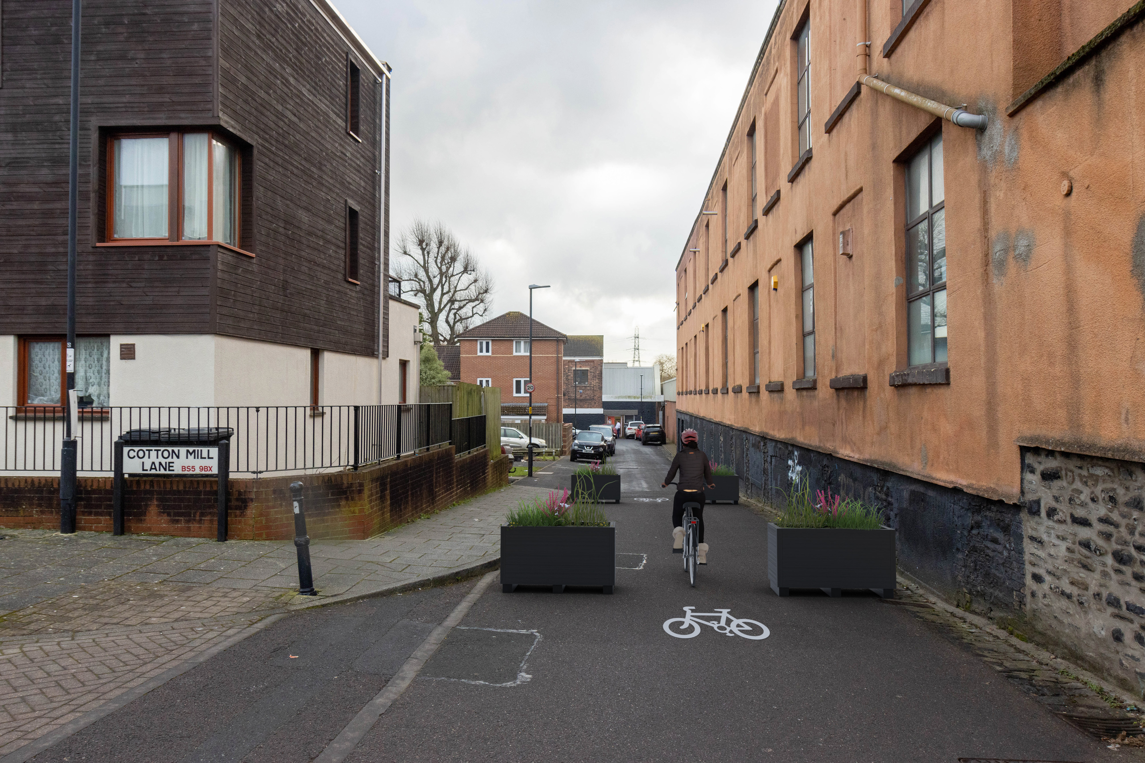 Planters used to stop traffic from entering the pedestrian area. Cycle symbols to show where cycles will access. 