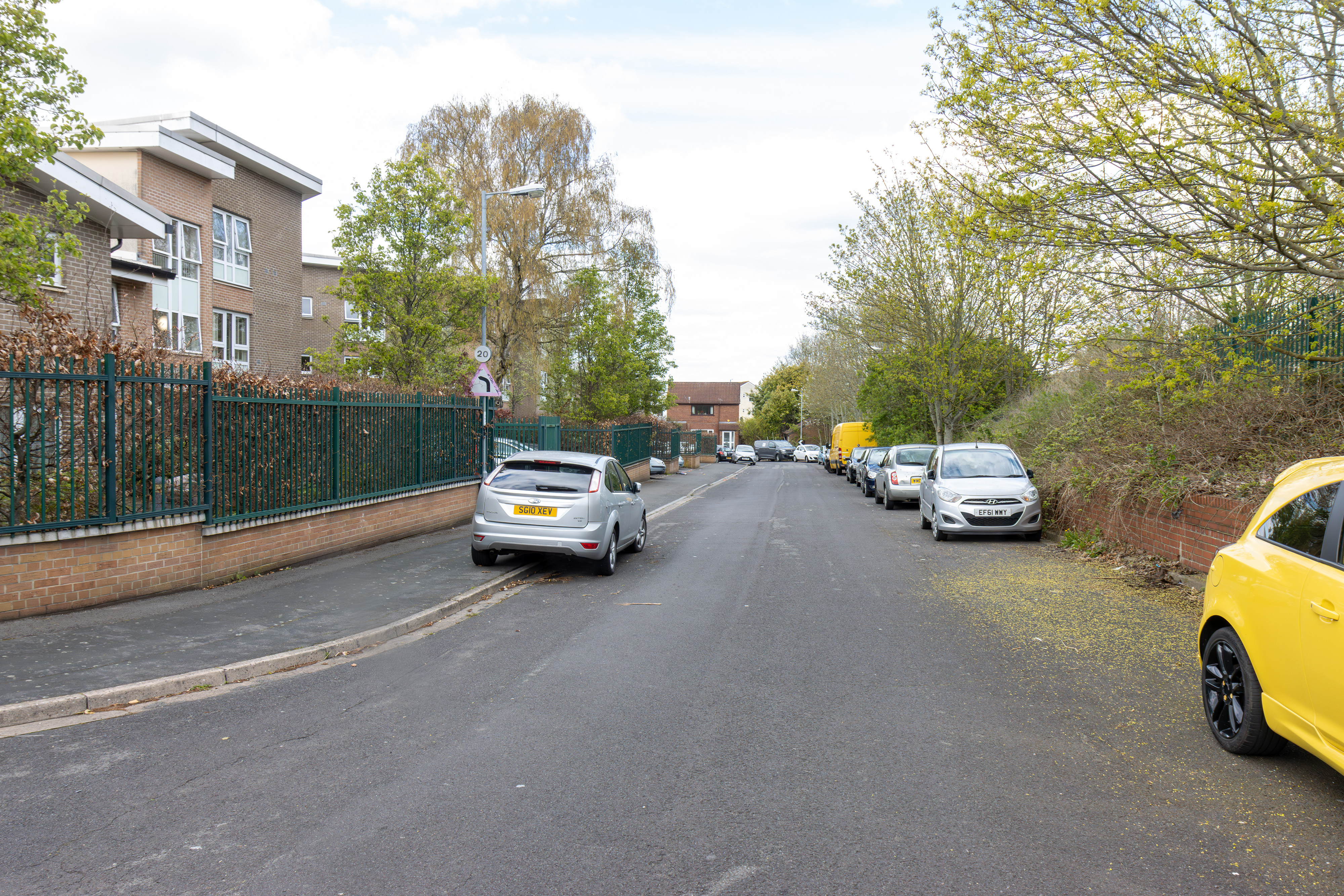 Empty street with a turning head and a disabled bay.