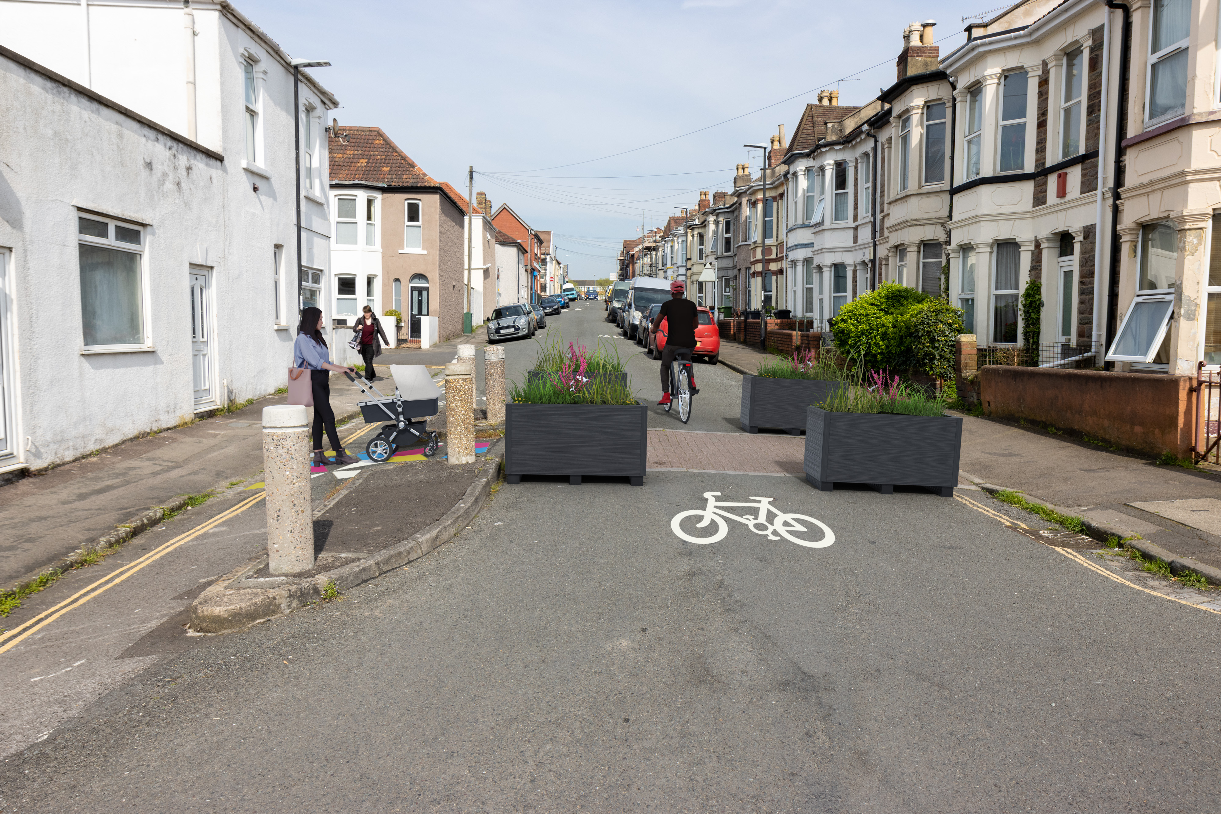 planters used to stop vehicles from entering the pedestrian area. Cycle symbols to show where cycles will access. Pedestrian crossing point highlighted in colourful pattern. 