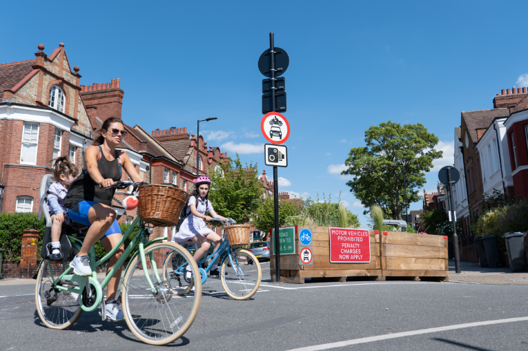 Family enjoying a safe cycle through a Lambeth Low Traffic Neighbourhood.