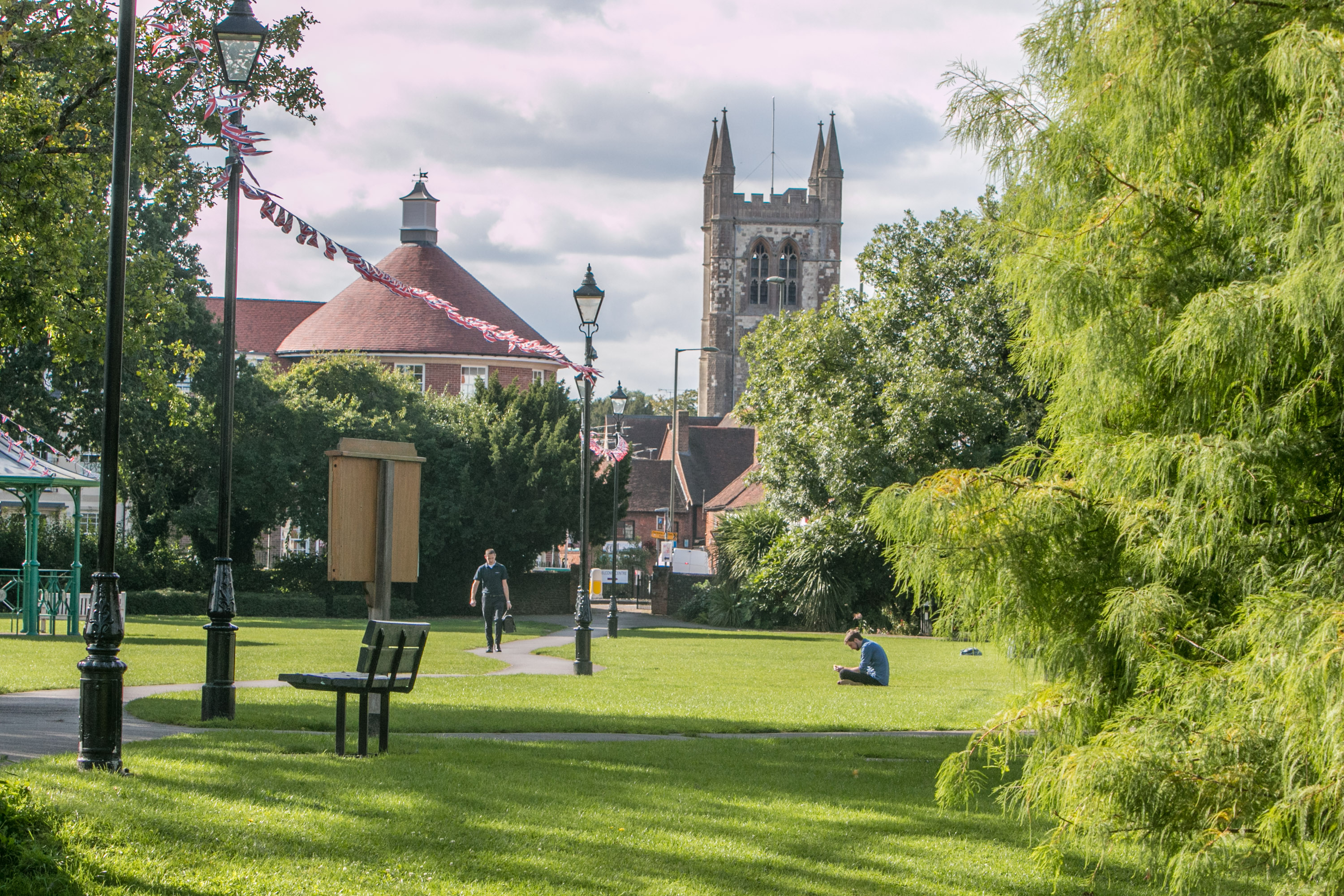 Picture of a park with a church in the background