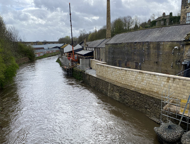 a partially clad flood wall