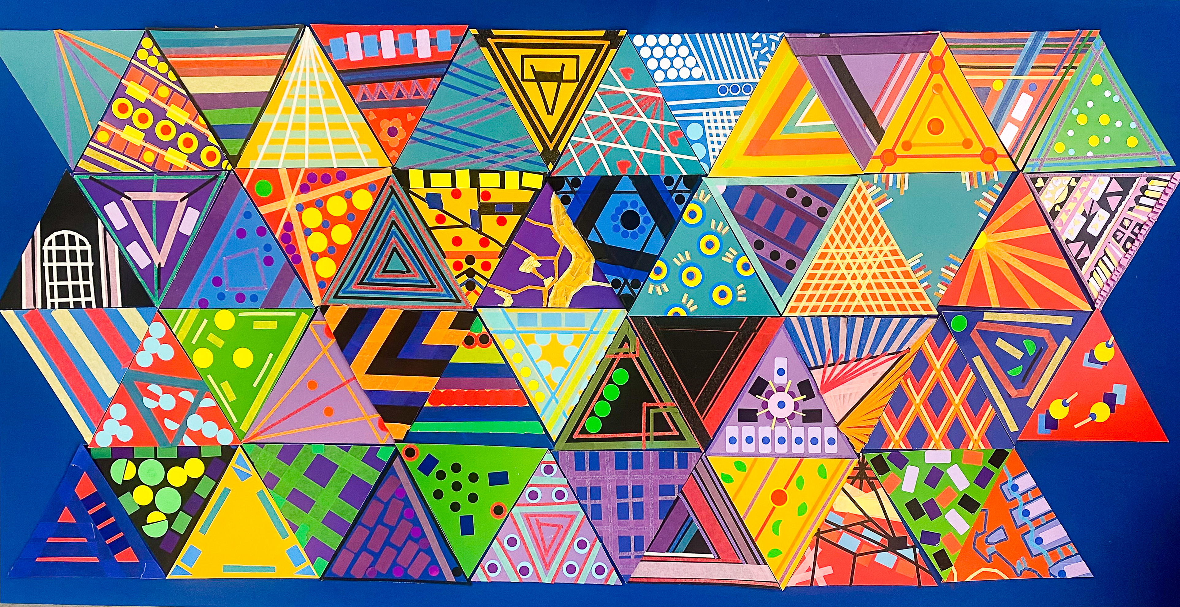 A multi-colour collage of patterned triangles