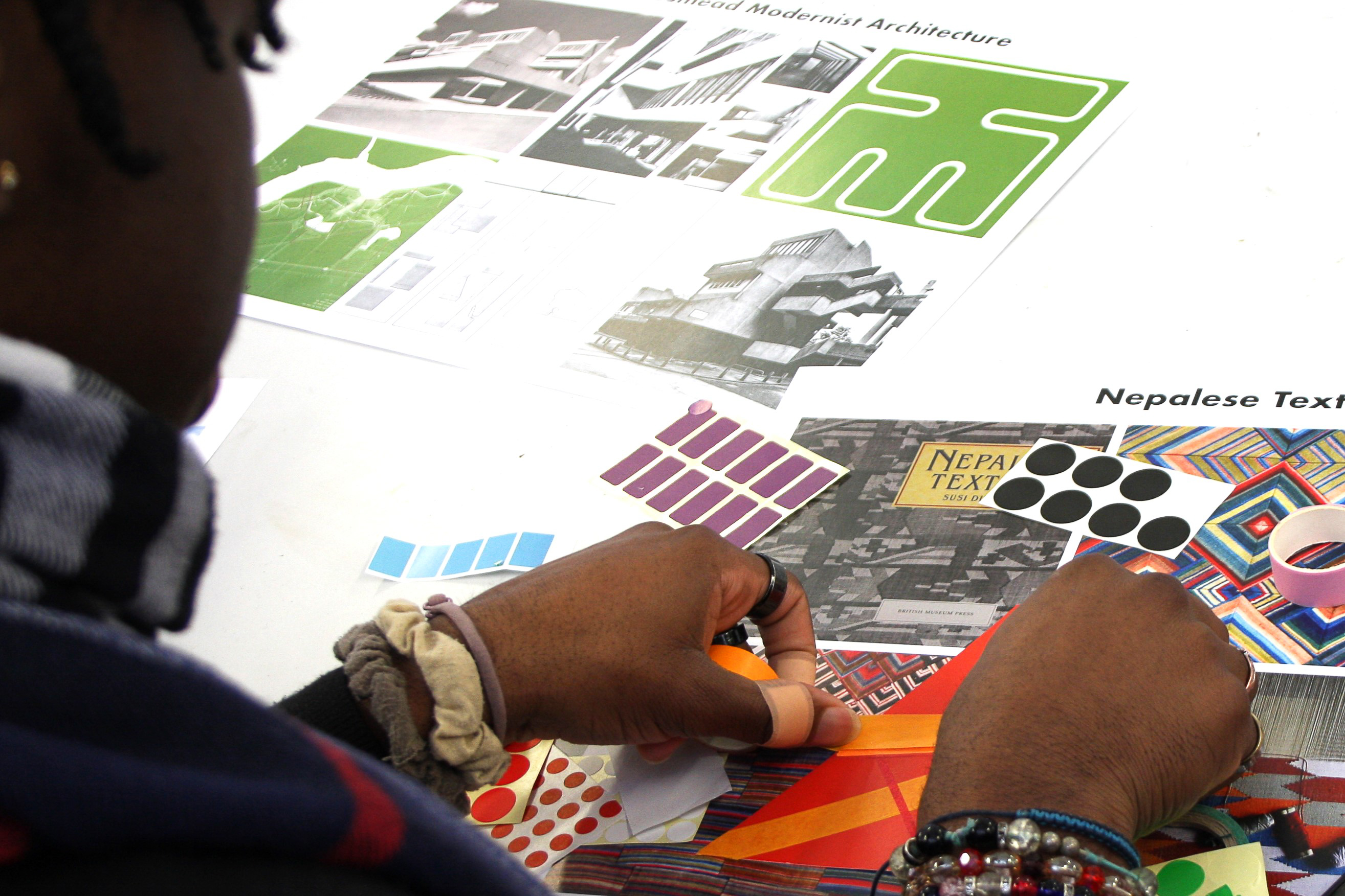 View over a student's shoulder looking at their artwork