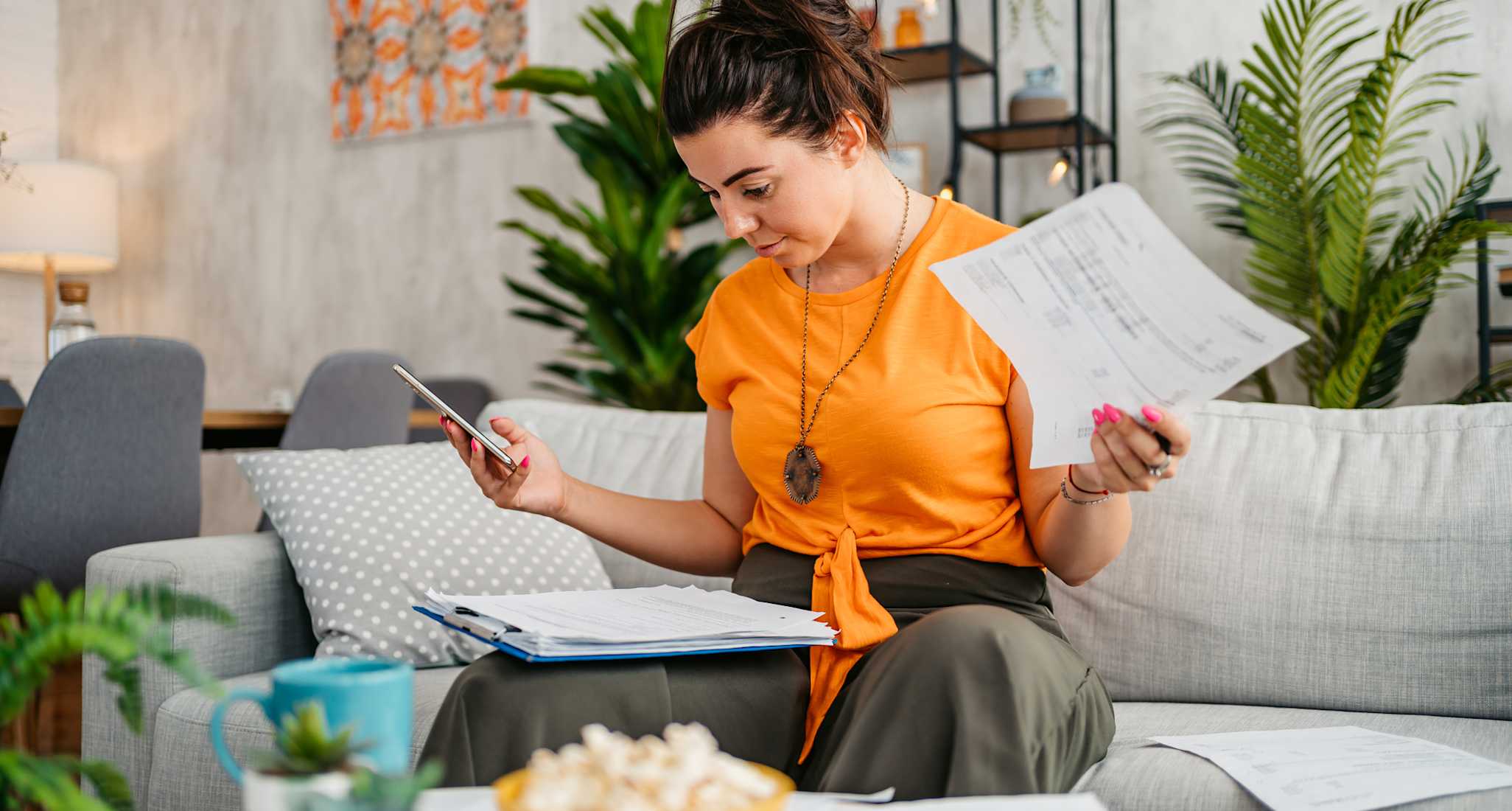 Young woman looking at various documents