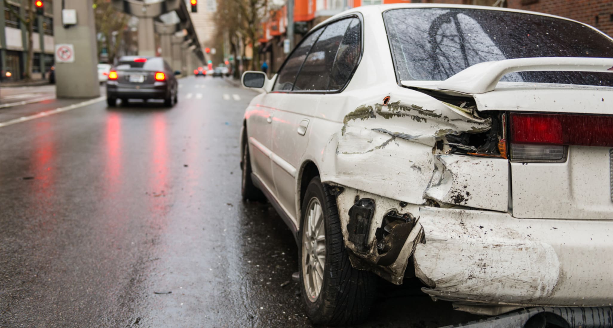 A white car has been damaged.